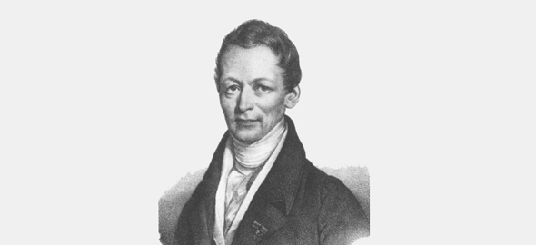 Ein Schwarz-Weiß-Porträt zeigt einen Mann mittleren Alters mit ernstem Blick und Halstuch.